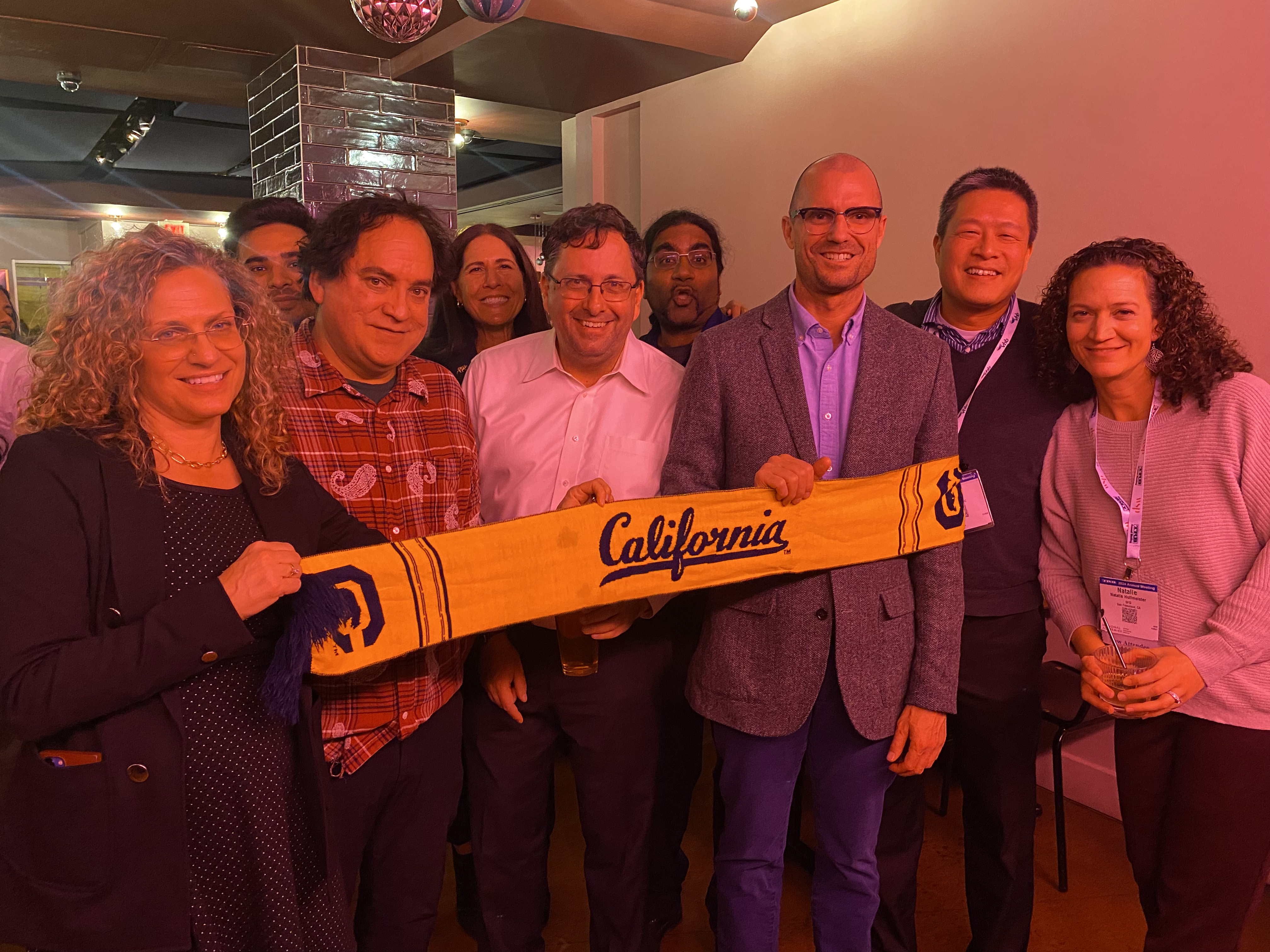 ITS Berkeley held a reception for Washington DC Cal alum, a group holds a Cal scarf