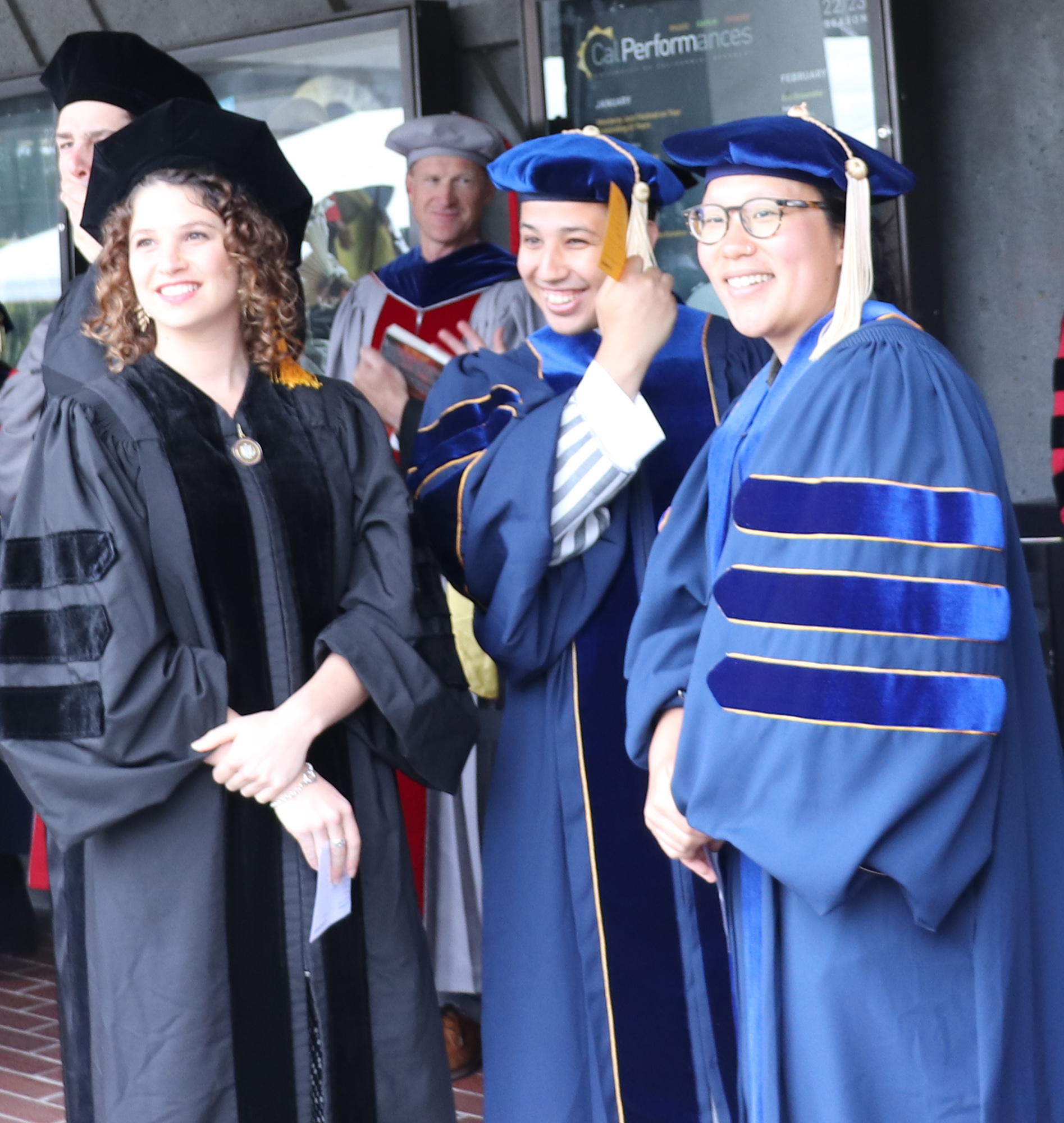 Professor Kenechi Soga hoods Dayu Apoji In line at commencement