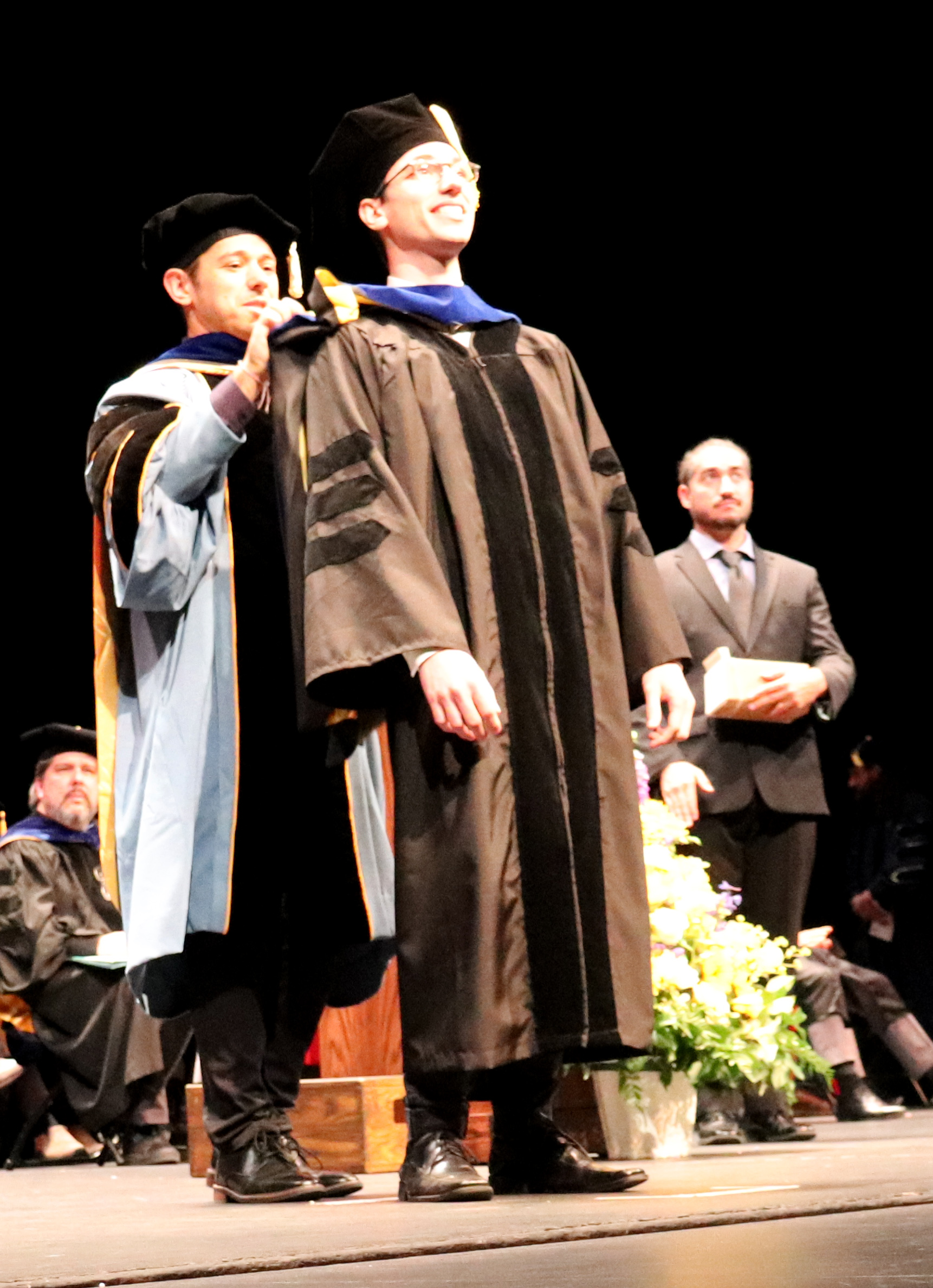 Professor Scott Moura hoods Aaron Kandel Professor Scott Moura hoods Aaron Kandel