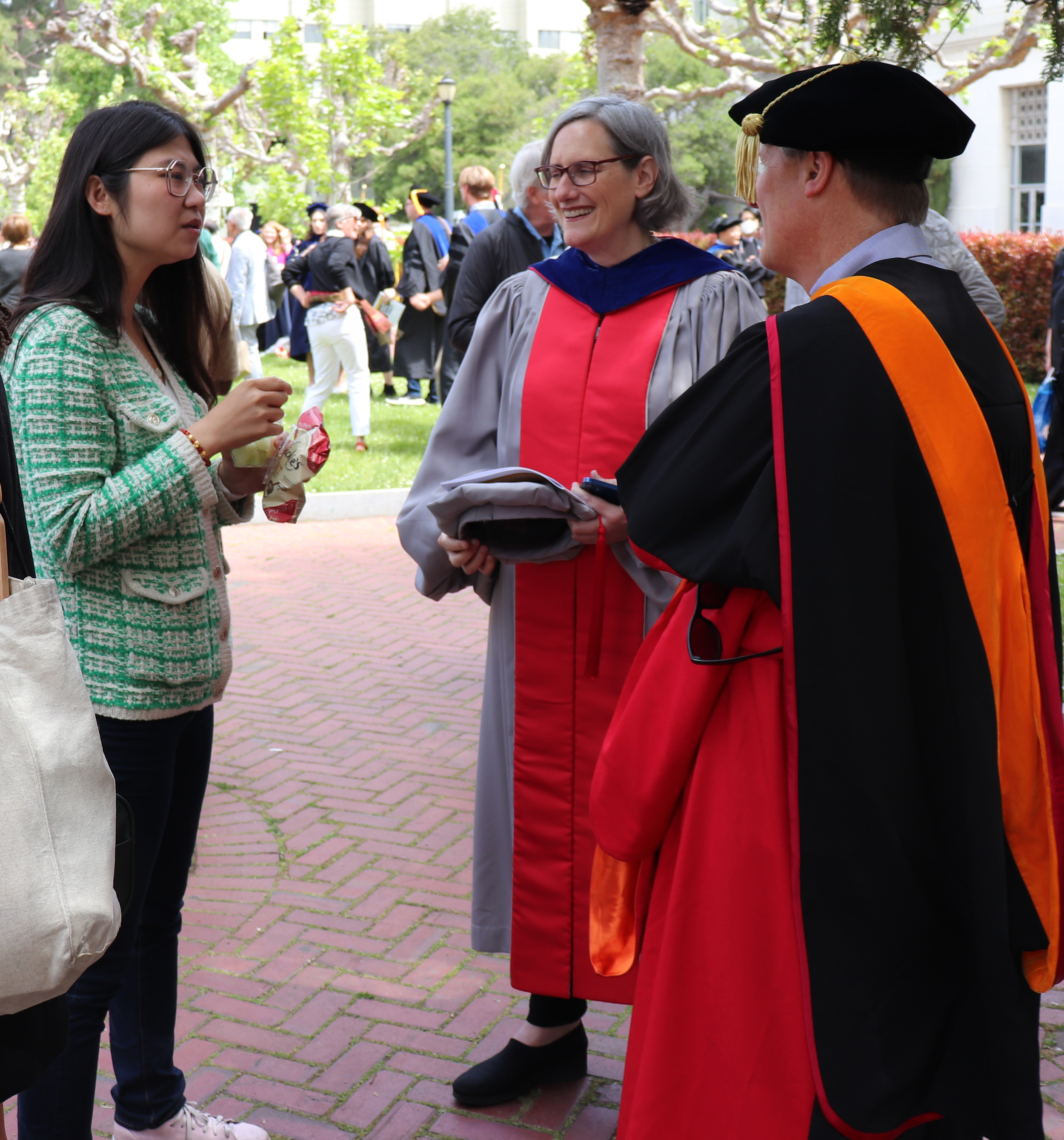 Current doctoral student Zhe Fu celebrates graduation with Professor Joan Walker and Professor Mark Stacey