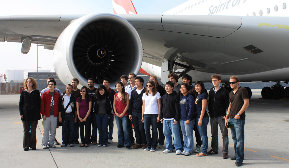Class photo with airplane
