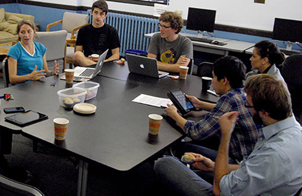 Students talking around a table