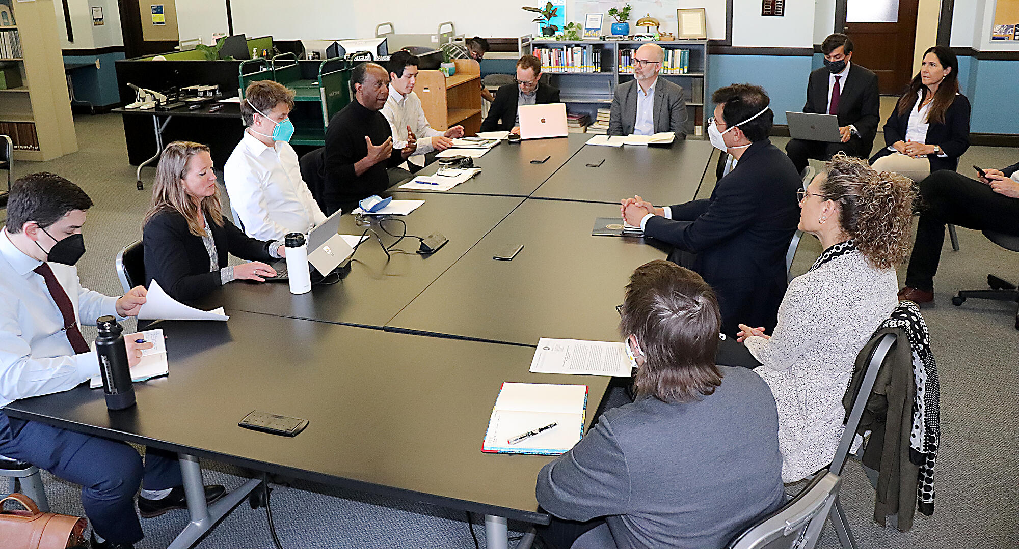 Members of the OPR and ITS Berkeley sitting in the ITS Library.