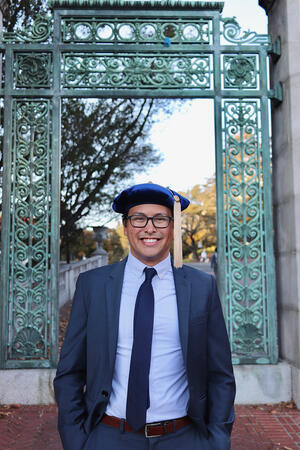 Stephen Wong Graduation cap in front of Sather Gate