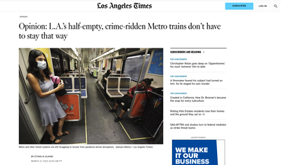 Woman with a mask on an LA metro train